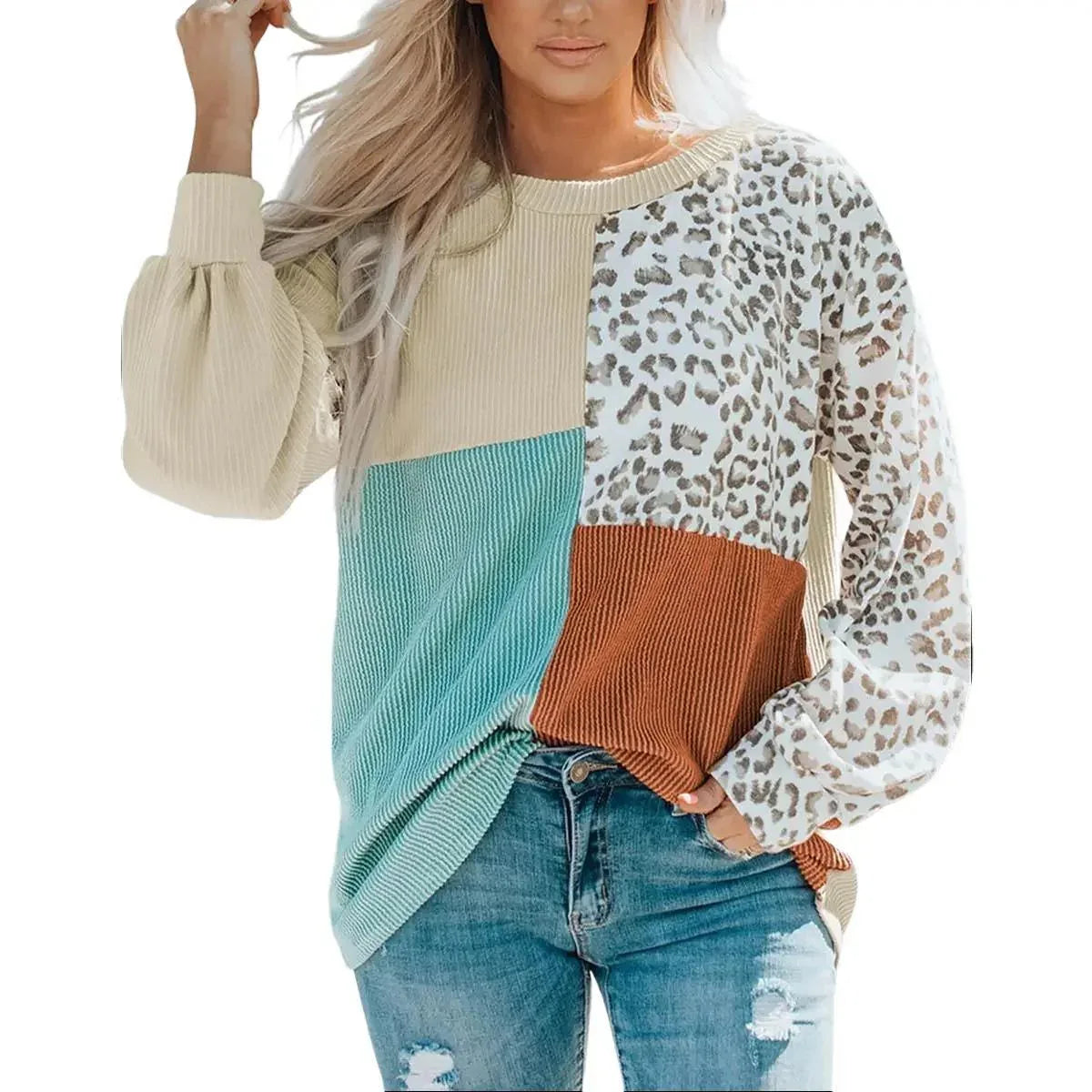 Leopard patchwork color block ribbed long sleeve top laid flat, showing front pattern and round neckline.