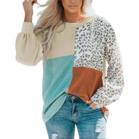 Leopard patchwork color block ribbed long sleeve top laid flat, showing front pattern and round neckline.