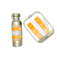 Stainless steel lunchbox and water bottle with locking clips and silicone seal lid close up.