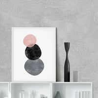 Abstract circles art print displayed on a wall in a minimalist room setting, frame not included.