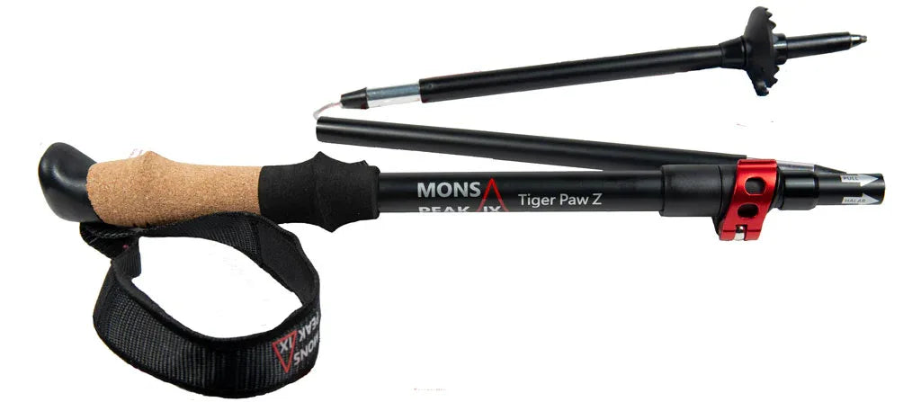Compact hand grip featuring cork and polymer combination on trekking pole handle.