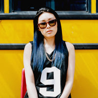 Sunglasses featuring thick temples and UV coated polarized lenses against a white background.