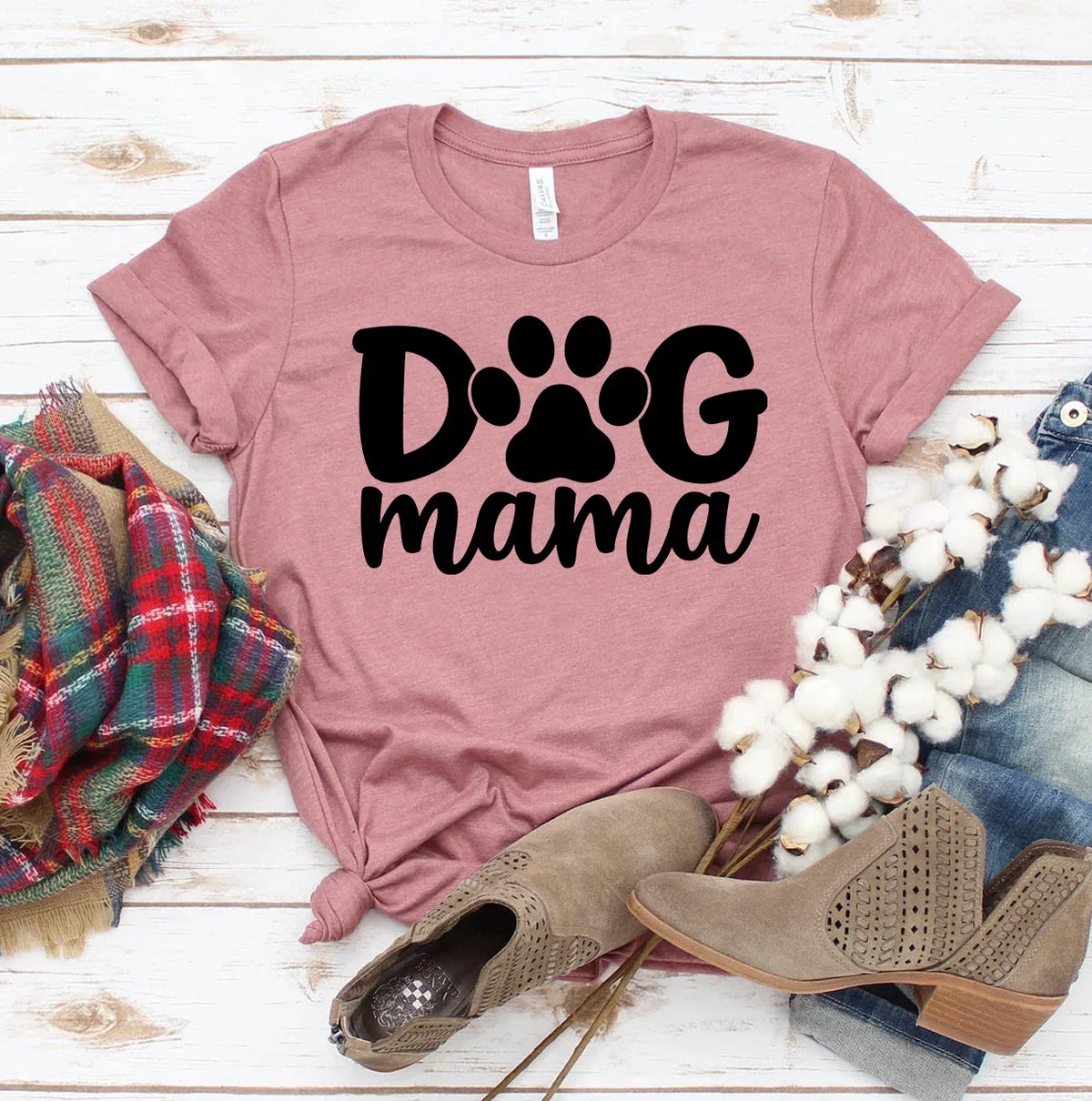 Front view of white Dog Mama T-shirt with black lettering, laid flat on a neutral background.