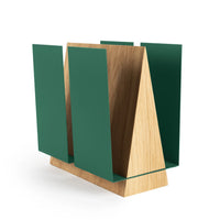 WINGS standing magazine holder displaying neatly organized magazines in a cozy lounge setting.
