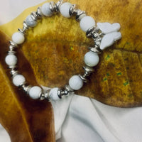 Stretch bracelet featuring spotted Dalmatian Jasper beads and shiny silver spacers