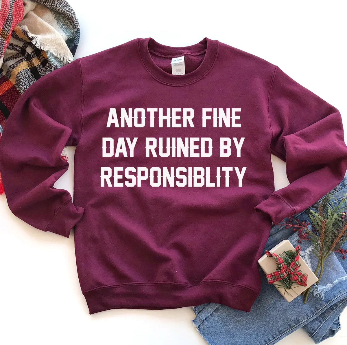 Hem of gray sweatshirt showing double-needle stitching and fabric texture