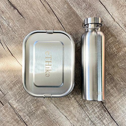 Double wall stainless steel water bottle with steel lid and silicone seal for leak resistance.