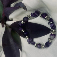 Purple agate chips and shiny silver spacers alternating on stretch bracelet