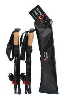 Close-up of black aluminum trekking pole shaft with locking mechanism and grip handles.