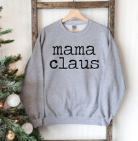 Front view of Mama Claus Christmas sweatshirt with festive holiday graphics on chest.