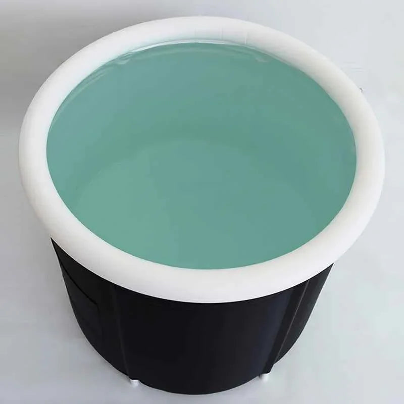 Ice bath tub unfolded showing spacious interior, with ice cubes inside for cold therapy use.