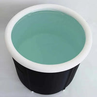 Ice bath tub unfolded showing spacious interior, with ice cubes inside for cold therapy use.