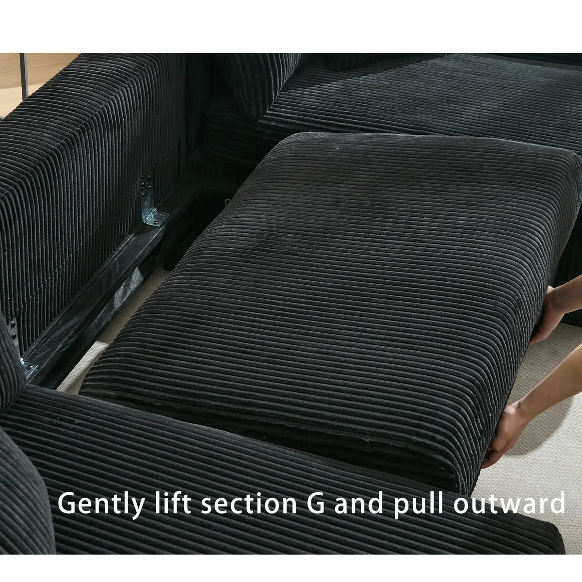 Large black U-shaped sleeper sofa with corduroy upholstery, square arms, and pull-out bed, seating for four.