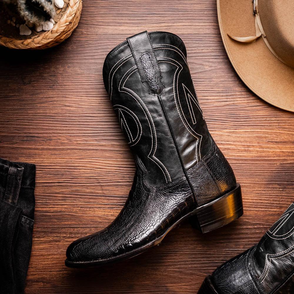 Denver Black boots styled with casual outfit on a person walking on stone pavement.