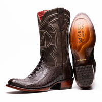 Close-up of Denver ostrich leg cowboy boot in brown showing detailed texture and stitching.
