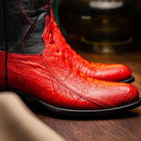 Lifestyle shot of Denver Red boots worn with jeans, featuring round toe and rich leather grain.