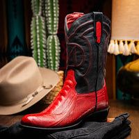 Side view of Denver Red boot highlighting black shaft, red pull tabs, and intricate stitching.