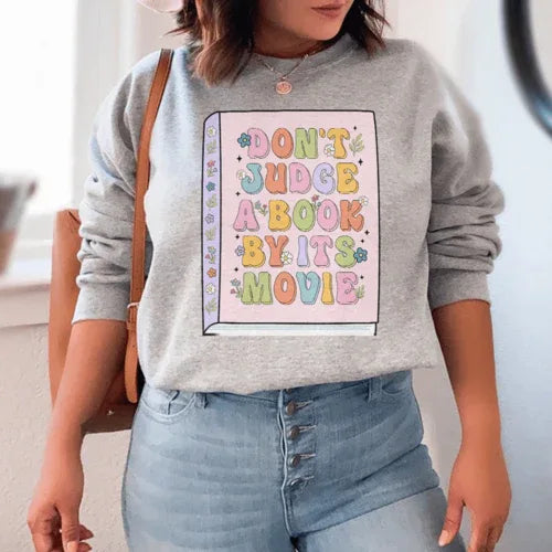 Sport grey 'Don't Judge A Book' sweatshirt with peachy pink text, size small, cozy fleece lining.