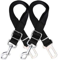 Two adjustable black dog seatbelt connectors attached to car seats, designed to safely restrain pets during travel.