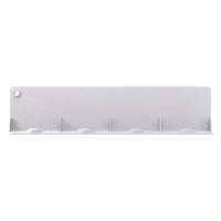 Top view of flexible silicone water baffle covering kitchen sink drain to prevent splashing.