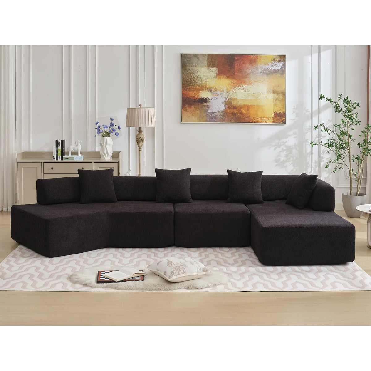 Overhead view of black L-shape sectional couch showcasing soft plush seating.