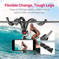 Side view of the gimbal tripod with flexible legs and phone clip on white backdrop.