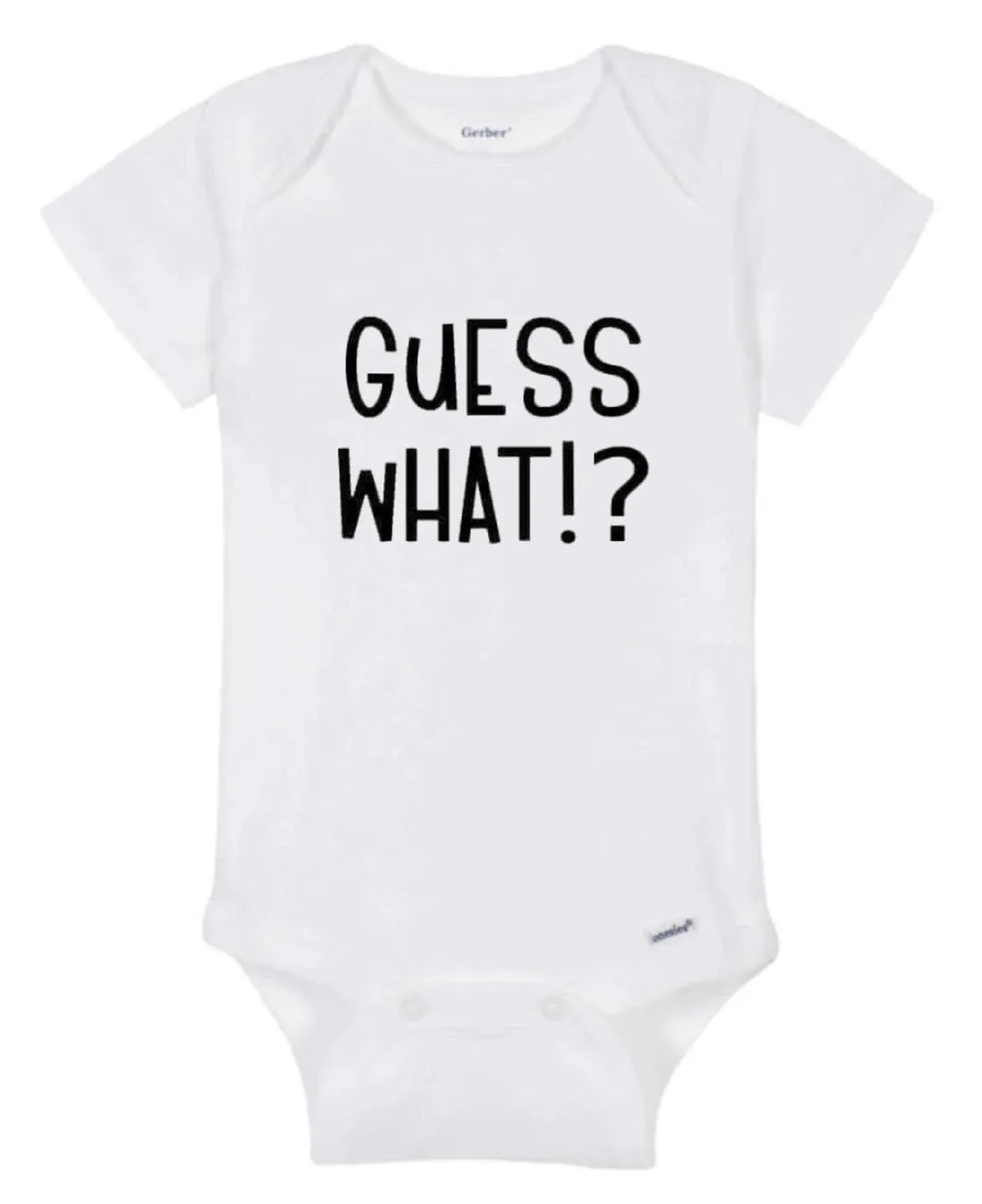 Close-up of white baby onesie fabric showing colorful 'Guess What!? Chicken Butt' print.