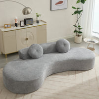 A modern gray curved sofa with plush cushions and upholstered polyester fabric, comfortably seating three people.