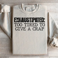 Sand-colored sweatshirt featuring peach text saying Exhaustipated To Tired To Give A Crap on front.