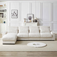 Large beige L-shaped corduroy sofa with cup holder and movable sections, seats four people comfortably.