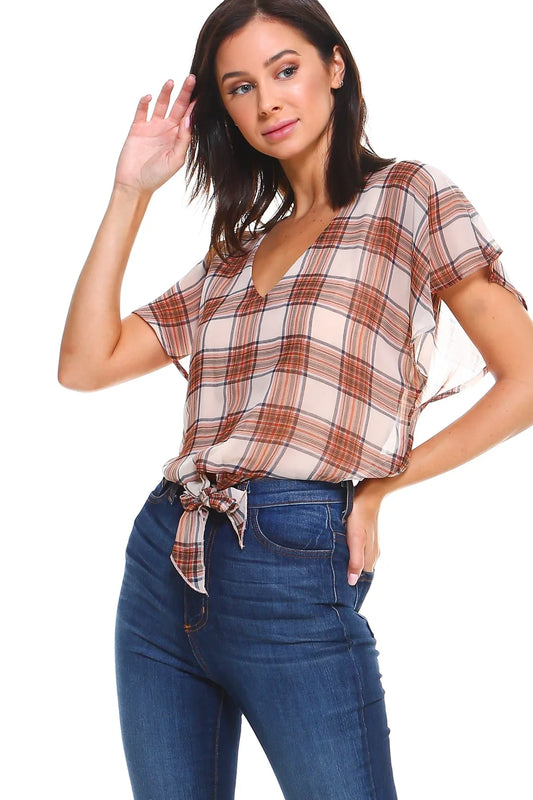 Front view of plaid V-neck tie-front blouse with flutter sleeves in soft fabric on white background.