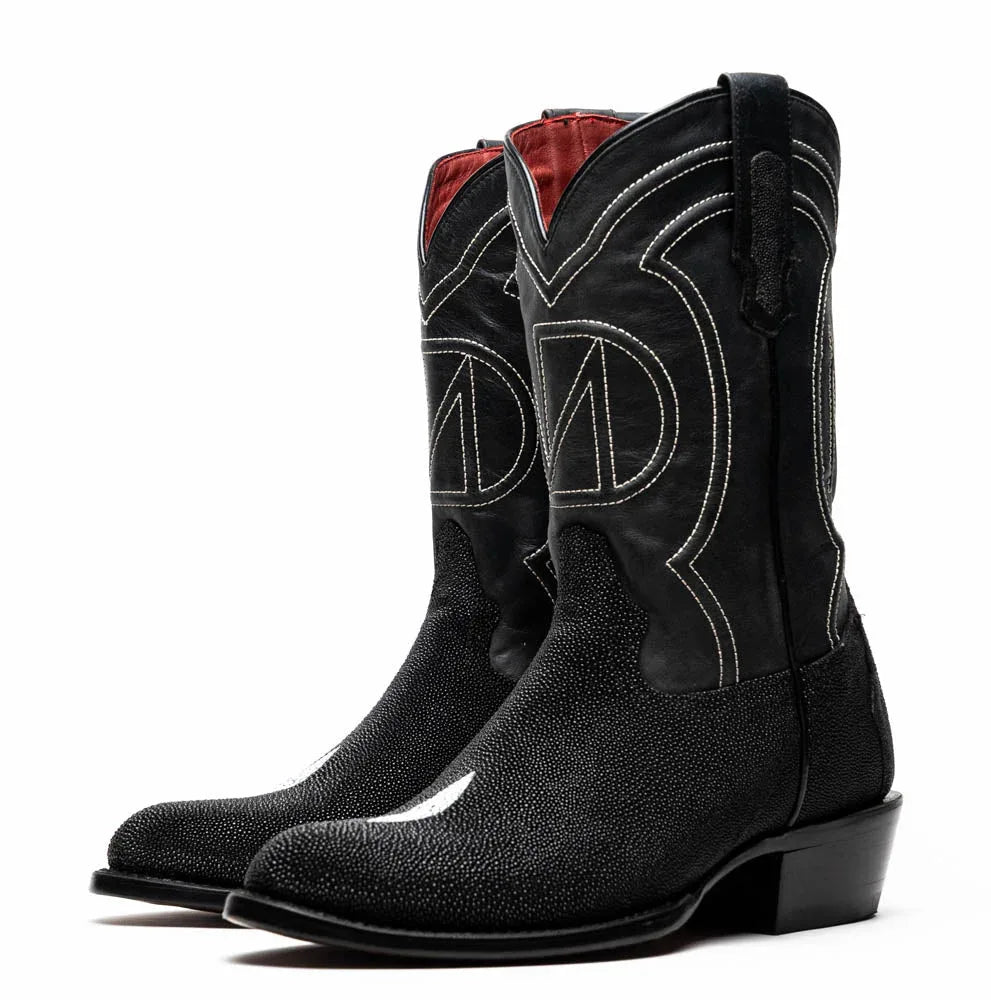 Oblique view highlighting round toe and smooth leather shaft of Georgia black stingray cowboy boot.