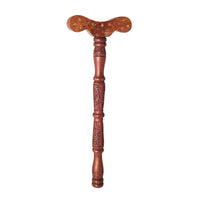 Wooden Yoga Danda Stick for breathing practice lying on a wooden surface with natural light