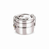A compact two-tier stainless steel lunch box with secure lock clips, shown closed and ready for packing meals.