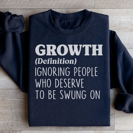 Black fleece sweatshirt with 'growth' design and adjustable banded cuffs.
