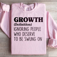 Light pink warm fleece sweatshirt with 'growth' design and adjustable cuffs.
