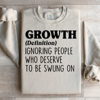 Sand colored fleece sweatshirt with soft fleece interior and 'growth' graphic.