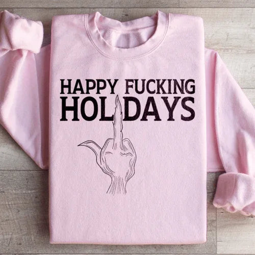 Light pink Happy Holidays sweatshirt featuring cozy fleece lining and festive peachy design