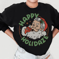 Front view of peachy Sunday sweatshirt with Happy Holidaze graphic in warm tones.