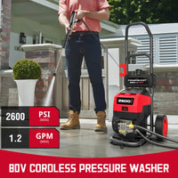 Close-up of pressure washer head and nozzle spraying water at high pressure