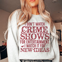 Peach-colored sweatshirt with bold white text reading 'I Don't Watch Crime Shows For Entertainment' on front.