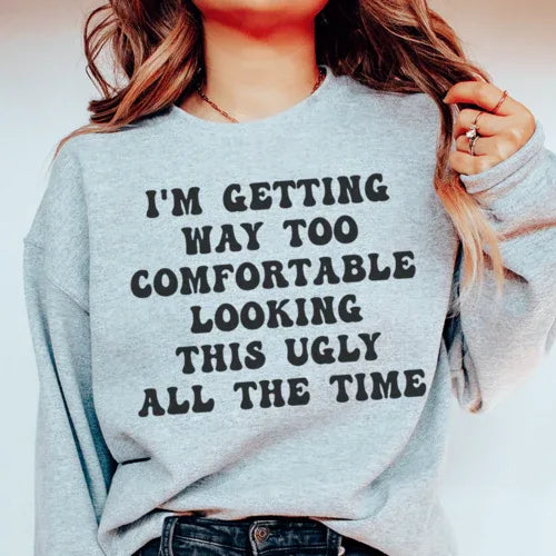 Sport grey sweatshirt featuring phrase 'I'm Getting Way Too Comfortable Looking This Ugly All The Time' in white and pink