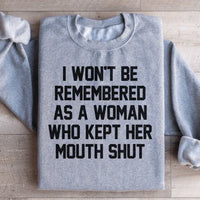 Sport grey sweatshirt with the phrase 'I Won't Be Remembered As A Woman Who Kept Her Mouth Shut' printed in white.