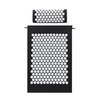 Side view showing thickness and spike-covered surface of black acupressure mat