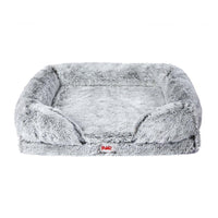Close-up of plush pet bed's memory foam mattress showing soft texture