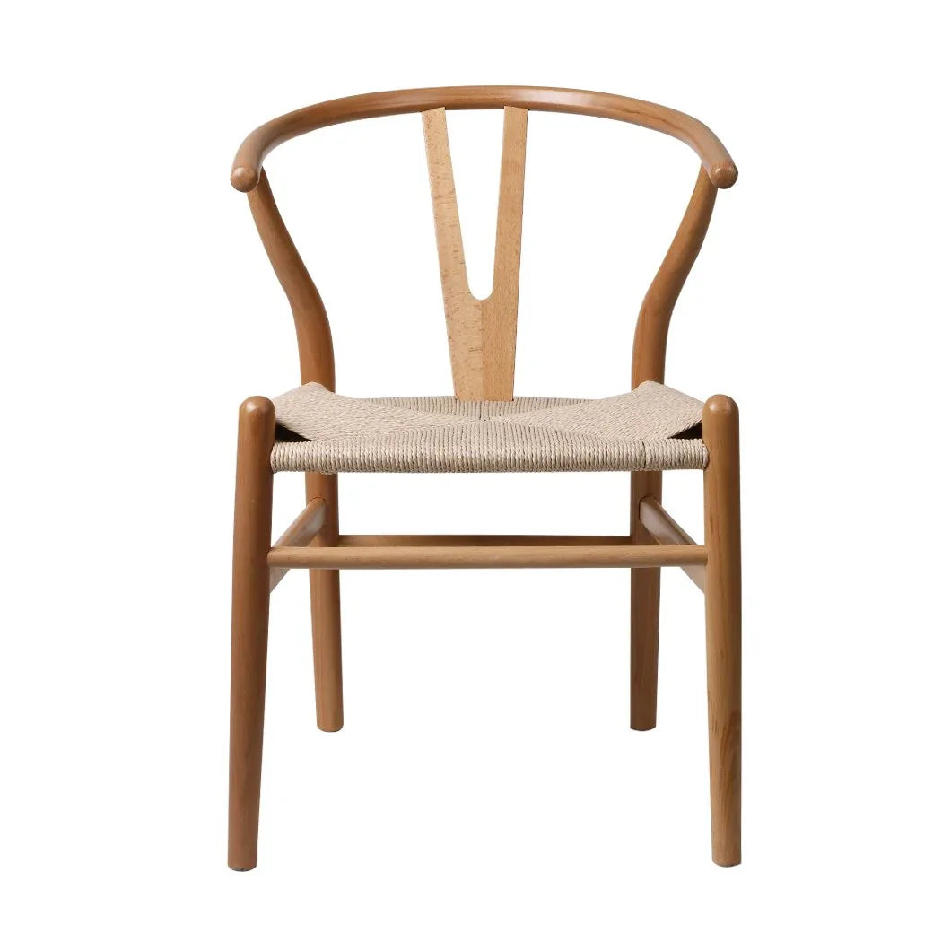 Close-up of a wood dining chair showing the woven rattan seat and sleek wooden frame detail.