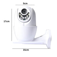 Security camera attached to outdoor wall near house entrance for home surveillance.