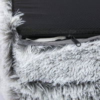 Side angle of cozy dog bed with cushioned border against white background