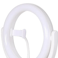 LED ring light with tripod stand folded down for easy travel and storage.