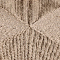 Side profile of a wood framed dining chair featuring a textured rattan seat.
